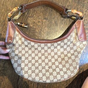 Gucci canvas and leather logo bag with bamboo detail